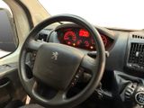 dashboard view of a car with a steering wheel and dashboard lights