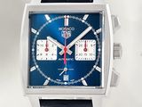 a close up of a watch with a blue face