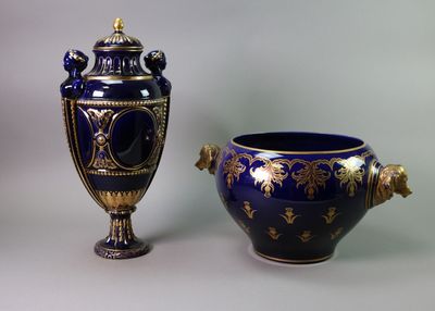 two vases sitting next to each other on a table