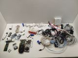 a white table with a bunch of electronics on it