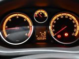 a close up of a speedometer and gauges in a car