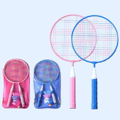 three tennis rackets that are sitting next to each other