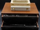 a wooden box with silverware in it on top of a table