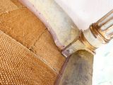 a close up view of a chair with a metal handle
