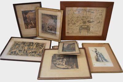 a lot of framed pictures on the table