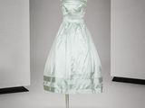 a dress on a mannequin stand in a room