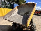 a dump truck that is sitting in the dirt