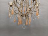 a chandelier that has a bunch of beads hanging from it