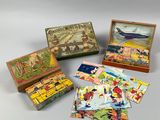 several small wooden boxes with pictures of people and animals in them