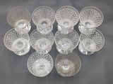 six clear glass bowls and a bowl on a black table