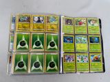 a lot of different pokemon cards on the table