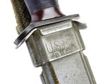 a close up of a knife with a metal handle