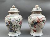 pair of chinese vases with birds and flowers painted on them