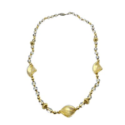 a close up of a necklace on a white background