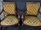two chairs that are sitting next to each other