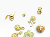 several different types of gold and silver jewelry on a white surface