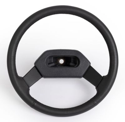 a close up of a steering wheel on a white background