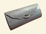 wallet case made of woven leather with a metal clasp