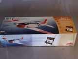 a box with a toy airplane in it on a table