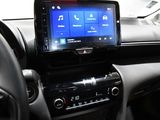 the dashboard of a car with a blue screen and a steering wheel