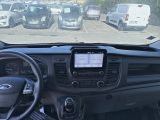 a view of a car ' s dashboard from inside of a vehicle