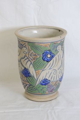 a blue and white vase with a bird on it