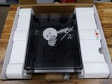a record player sitting inside of a box on a table