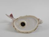 an image of a white and pink fish figurine on a white surface