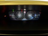 the dashboard of a car with a digital display showing the speed of the car