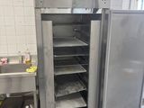 an open refrigerator in the middle of a kitchen