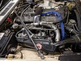 a picture of a car engine with its hood open
