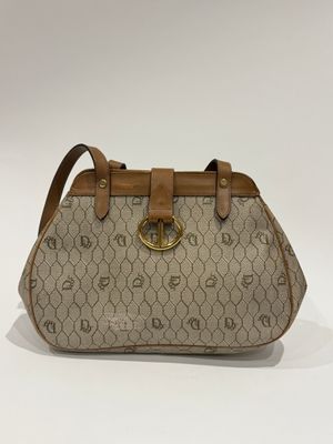 a beige and brown handbag with a brown handle