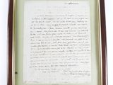 framed photograph of a letter written by a man in a suit