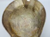 a brown bowl that is sitting on a table