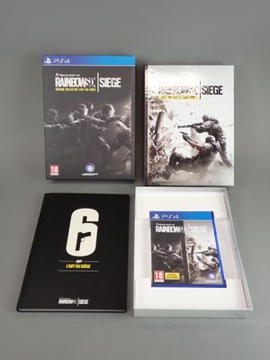 three video games sitting on top of a table next to each other