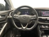 the interior of a car with a steering wheel and dashboard controls