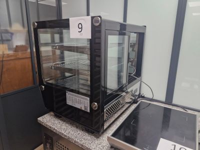 a display case with a glass door on top of a counter