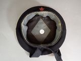 a black hat with a red star on it