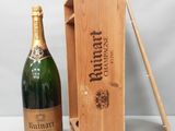 une image représentant une bouteille de champagne et une boîte en bois