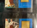 two stamps with a picture of a woman in a dress and a man in a robe