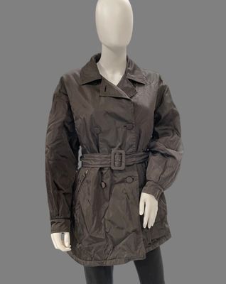 an image of a mannequin wearing a brown coat and black tights