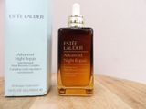 a bottle of estee lauder advanced night repair oil next to a box of estee lauder
