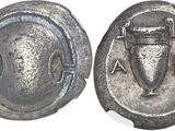 an ancient coin with a shield and a shield on it