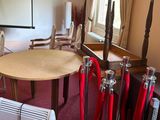 a room with a table, chairs, and a projector screen