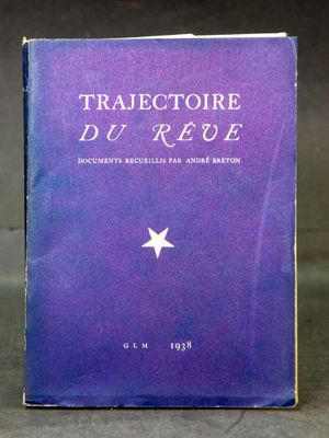 an old book sitting on top of a table with a star on it