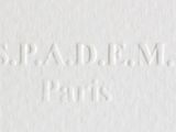 a close up of a white book with the words spaldom paris on it