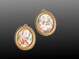 two miniature paintings of a woman and child in a gold frame