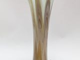 a glass vase that is sitting on a table
