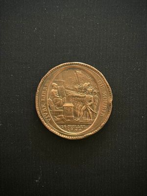 an image of a gold coin with a picture of a man on a horse drawn carriage
