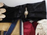 many different types of clothing and accessories laid out on a table